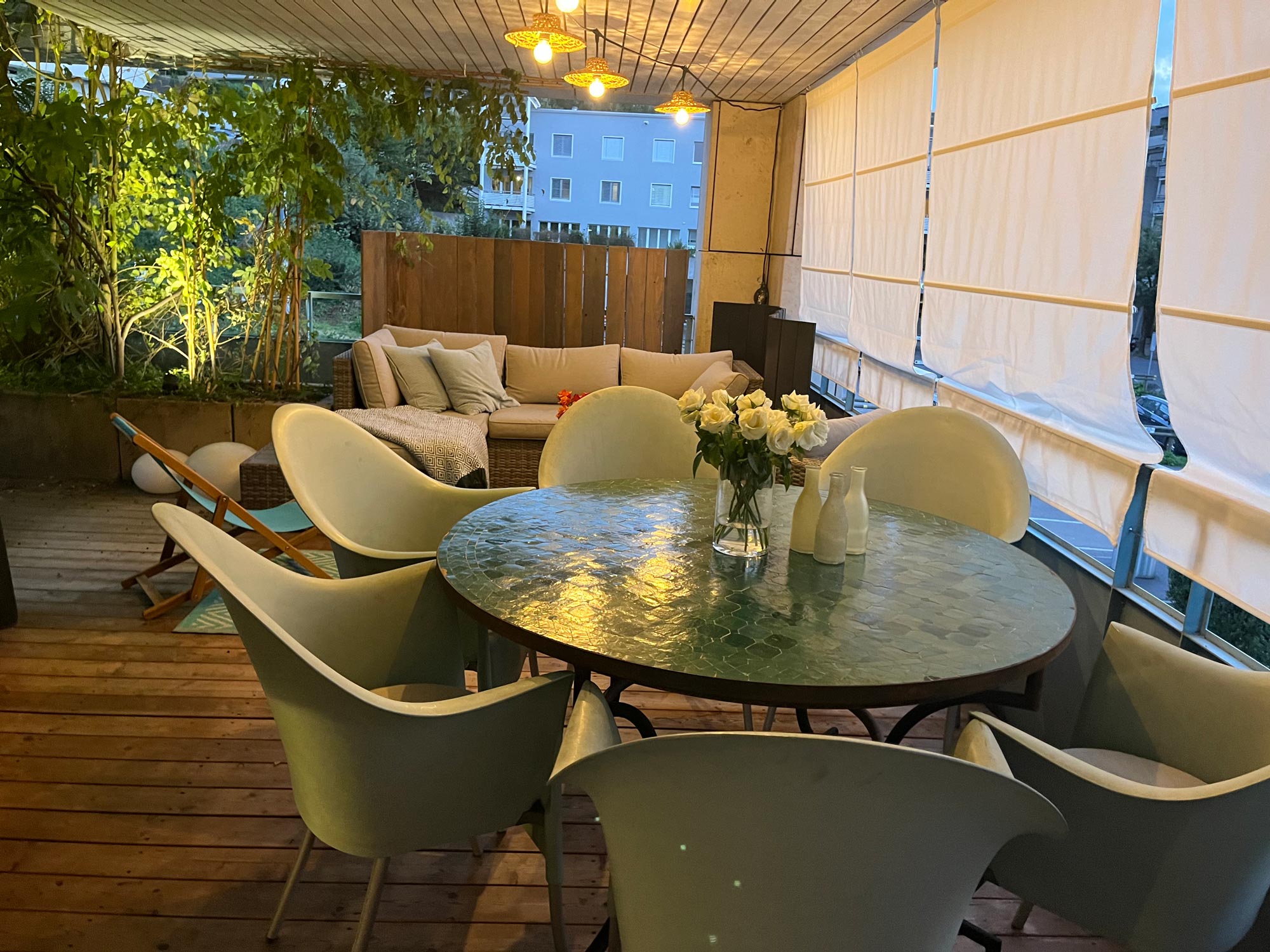 Patio with dining table and sofa group